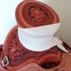Half tooled Vaquero Lace with Daffodil flower Wade Saddle
built on a 94 degree bar that fits a well built muscular shoulders -
The seat is finished at 15 & 1/2 inch with a close contact deep pocket fit -
Gullet is 7 & 1/2 inch height by 6 & 1/2 width with the back hand hole width at 4 inch -
Horn is 6 inch height by 5 and 1/2 inch width Guadalajara at 31 degree pitch - Cantle is 4 and 1/2 inch in height by 12 & 1/2 in width with a Cheyenne roll - Flat plate riggin at 7/8ths
- leather lined 5 inch Stainless Steel Moran Stirrups .